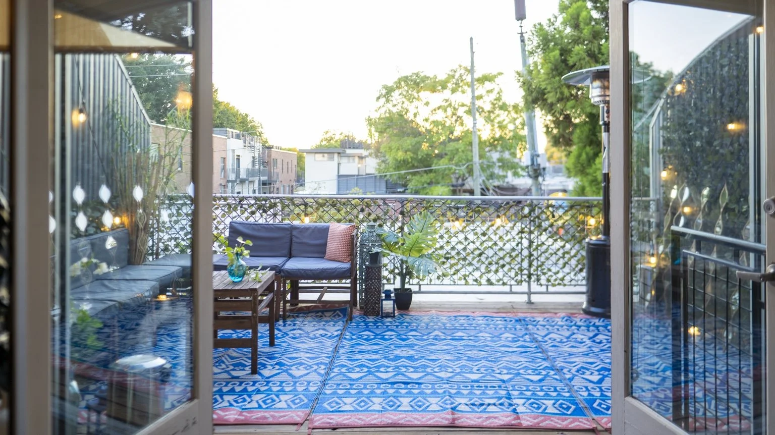 Open doors leading to the furnished patio.
