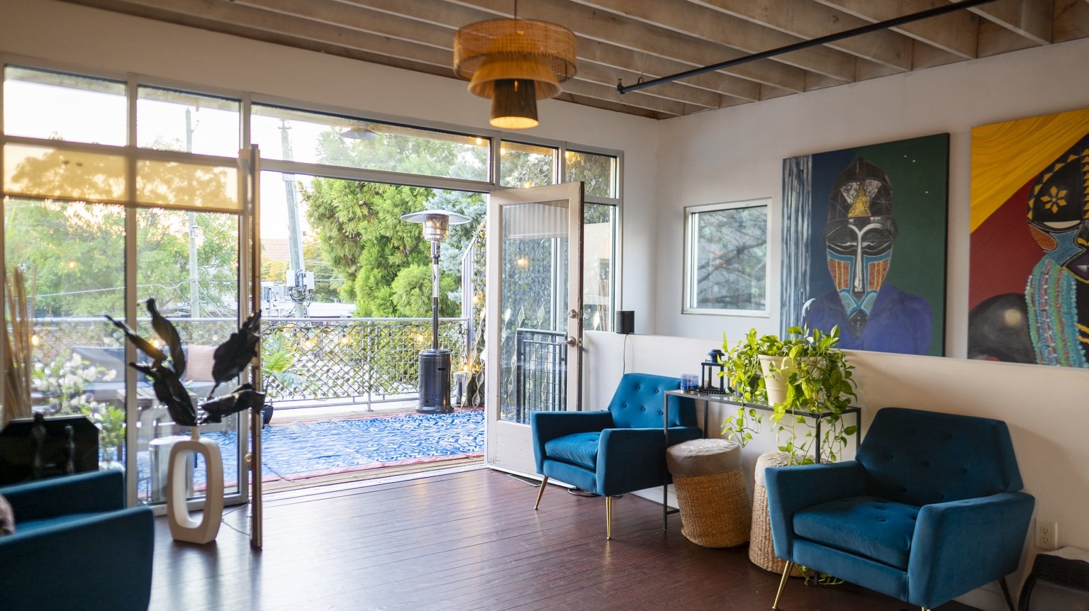 Blue lounge chairs beside the patio doors.
