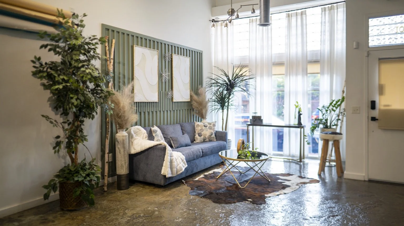 Wide view of the studio lounge and photography area.