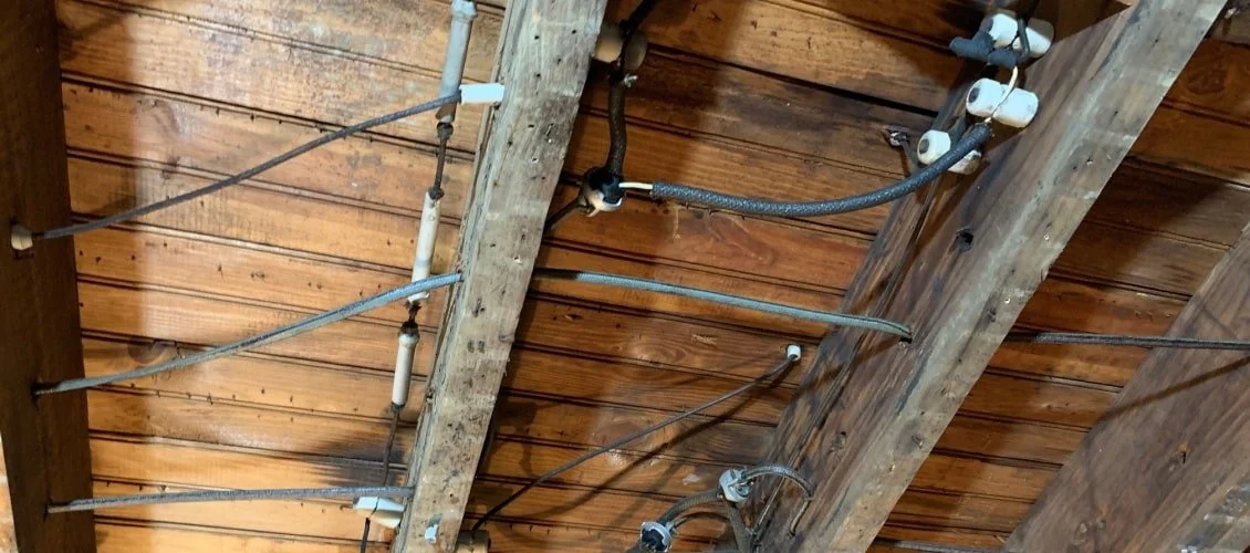 Knob-and-tube wiring visible in an older home.