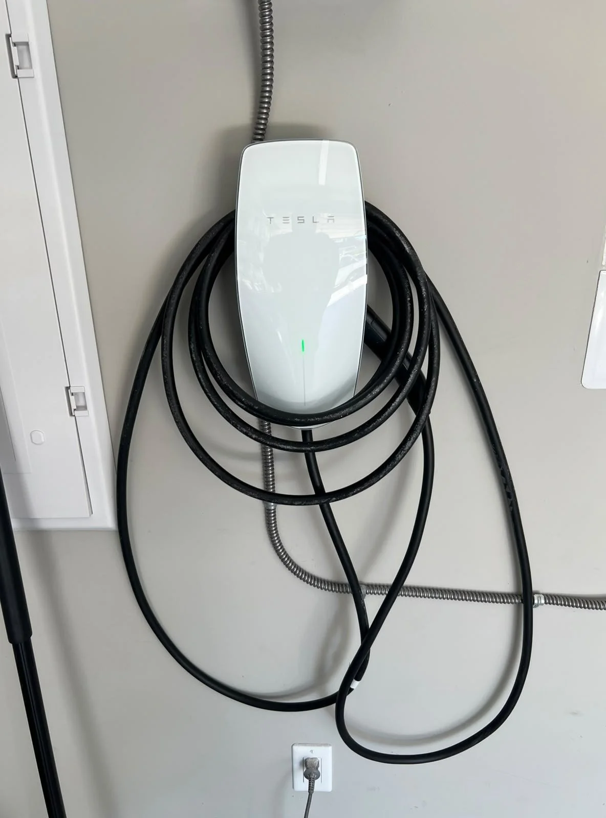 Tesla Wall Connector installed in a residential garage