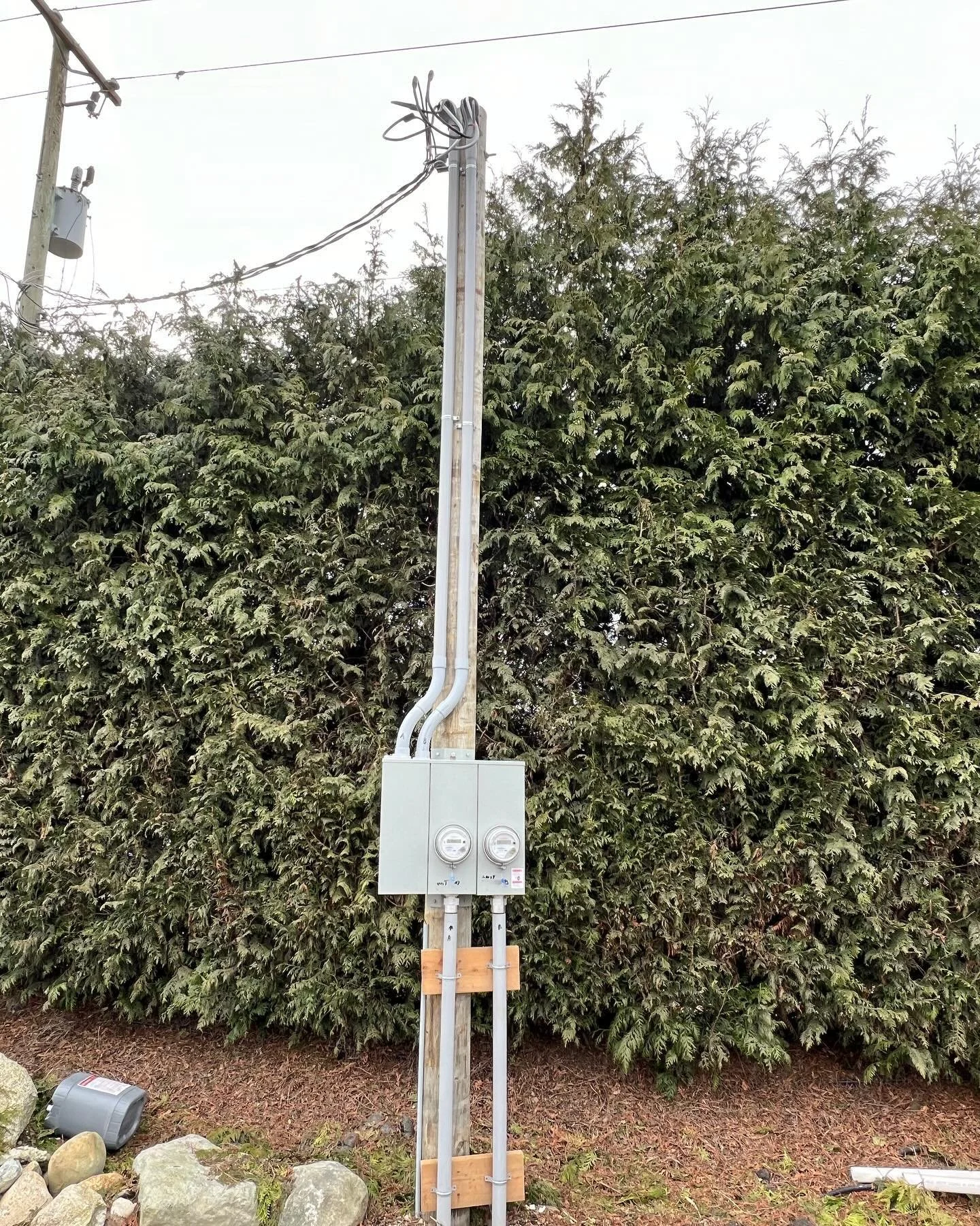 Outdoor electrical service pole installation