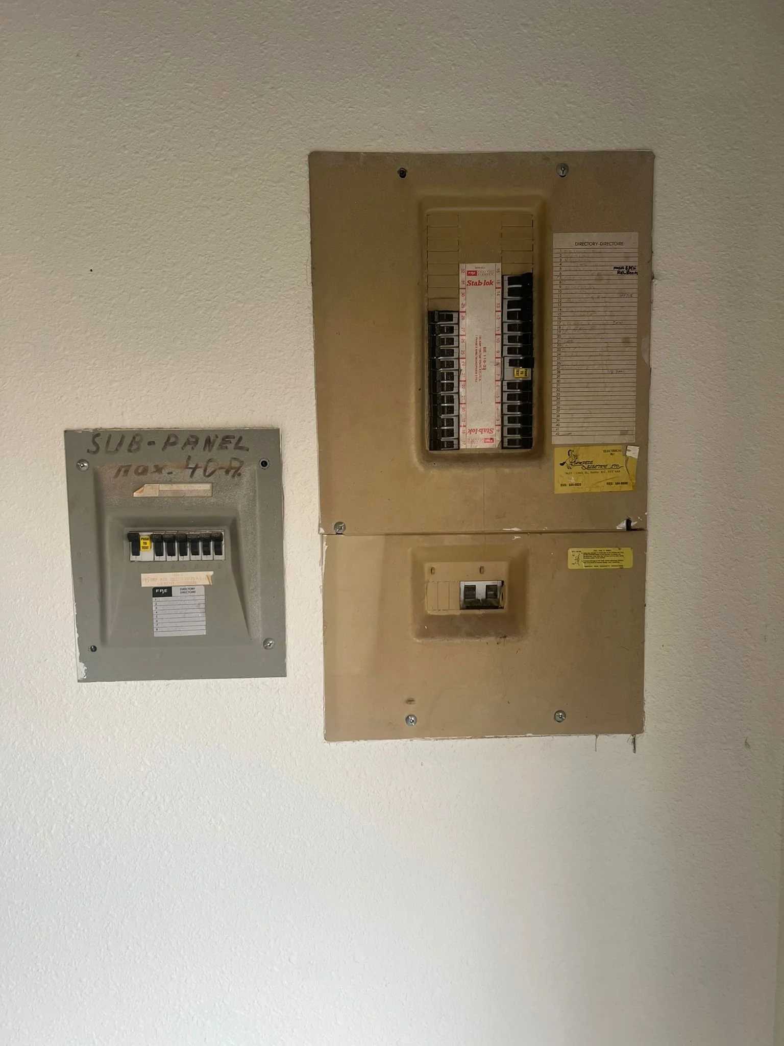 Existing 100 amp residential electrical service and Stab-Lok panel before upgrade