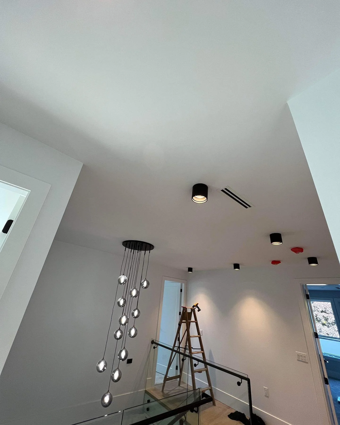 High ceiling pendant lighting installation