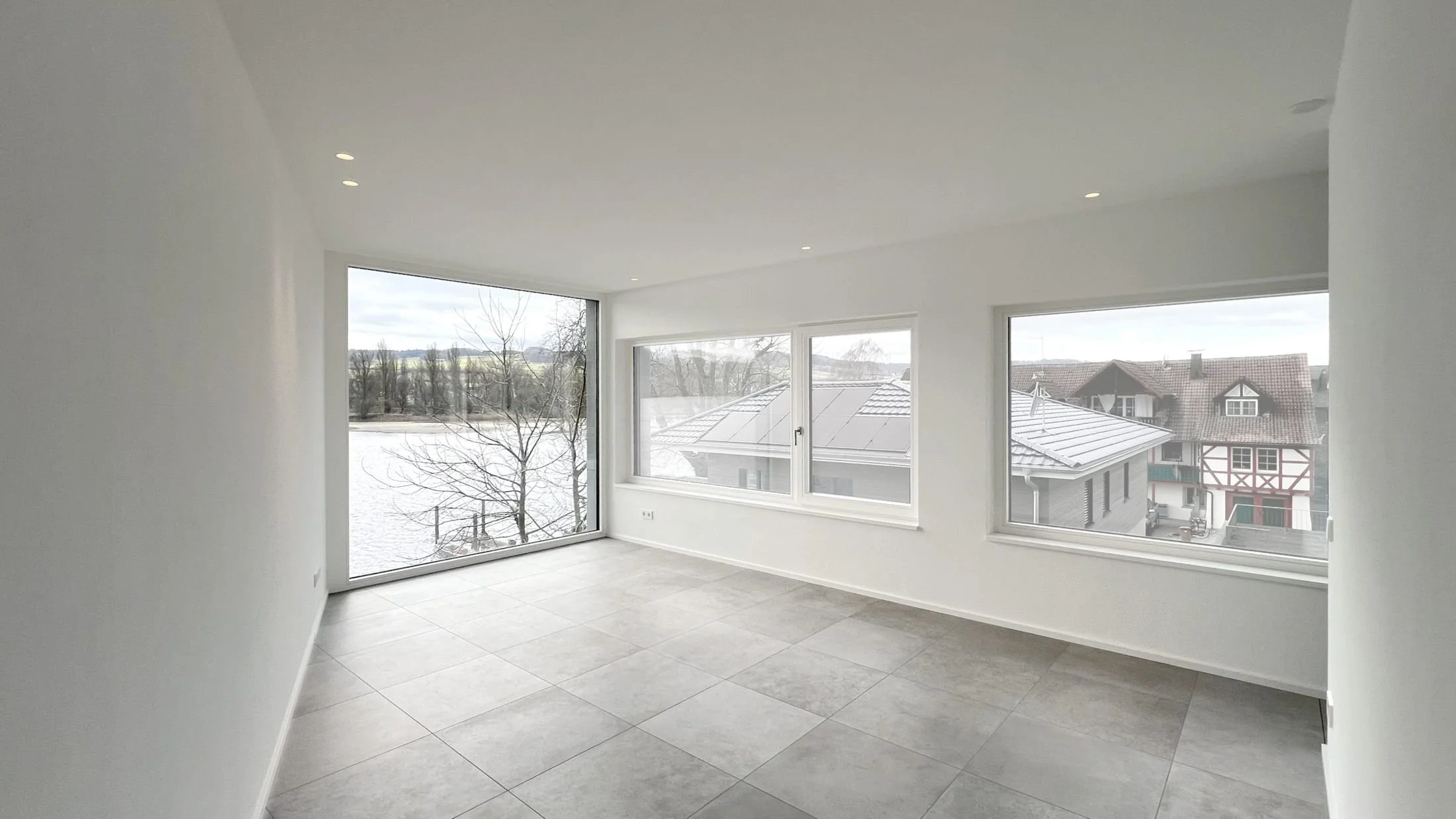 Room with windows facing the lake