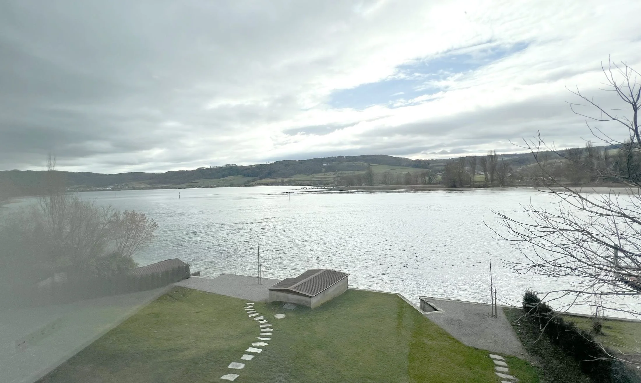 View from the house across the garden and private lake access to the Untersee