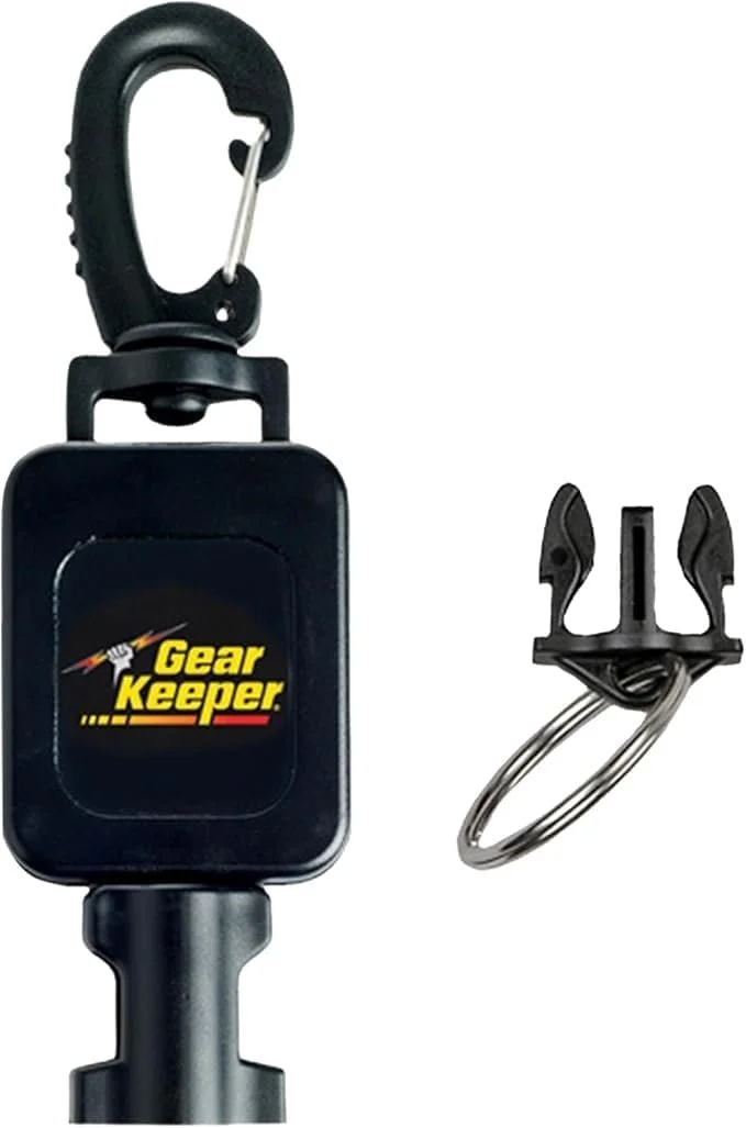 A retractable scuba diving clip for seguring streamlined equipment underwater