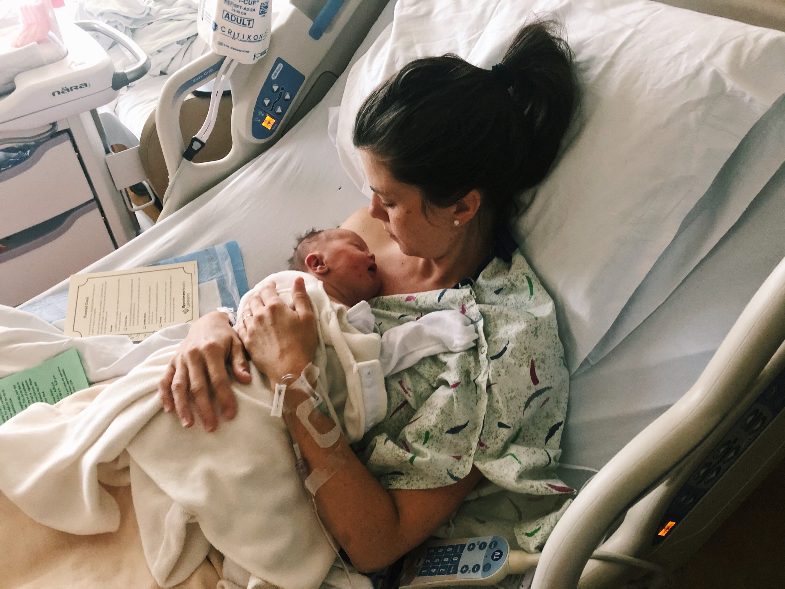 Danielle holding newborn Sammie in the hospital