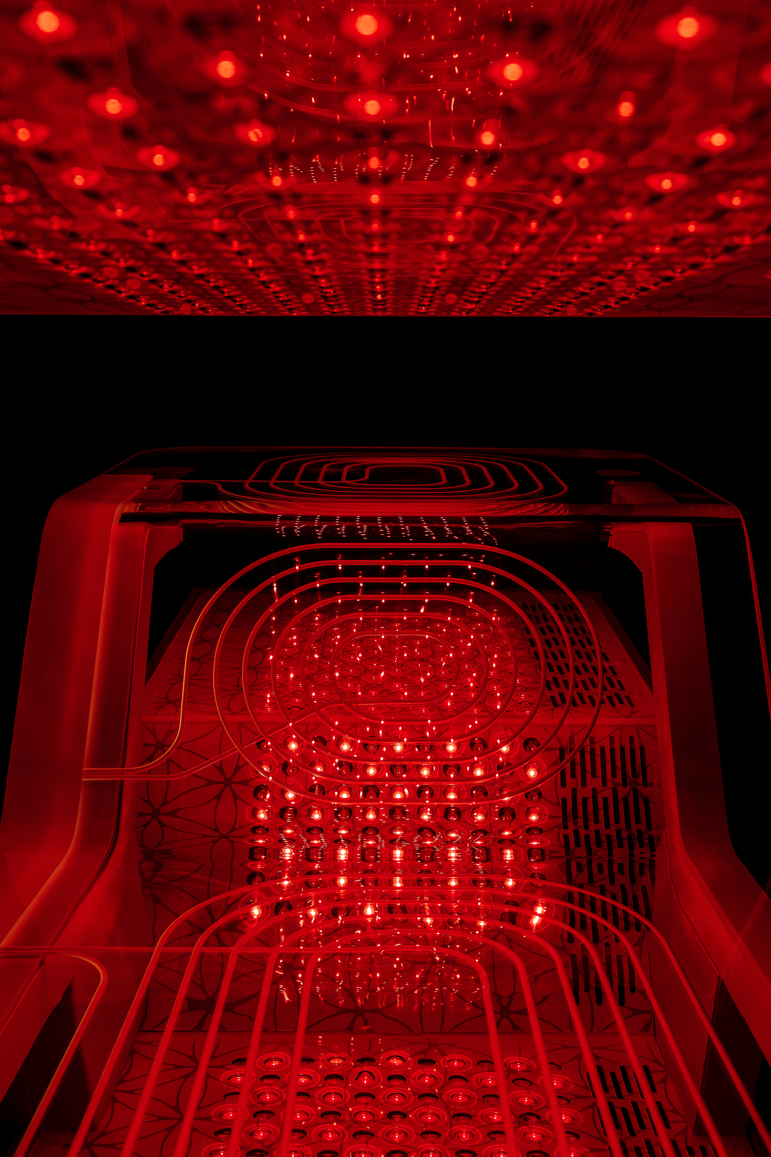 Red light arrays glowing inside the Ammortal Chamber at Atlas Men's Health, Midtown Manhattan
