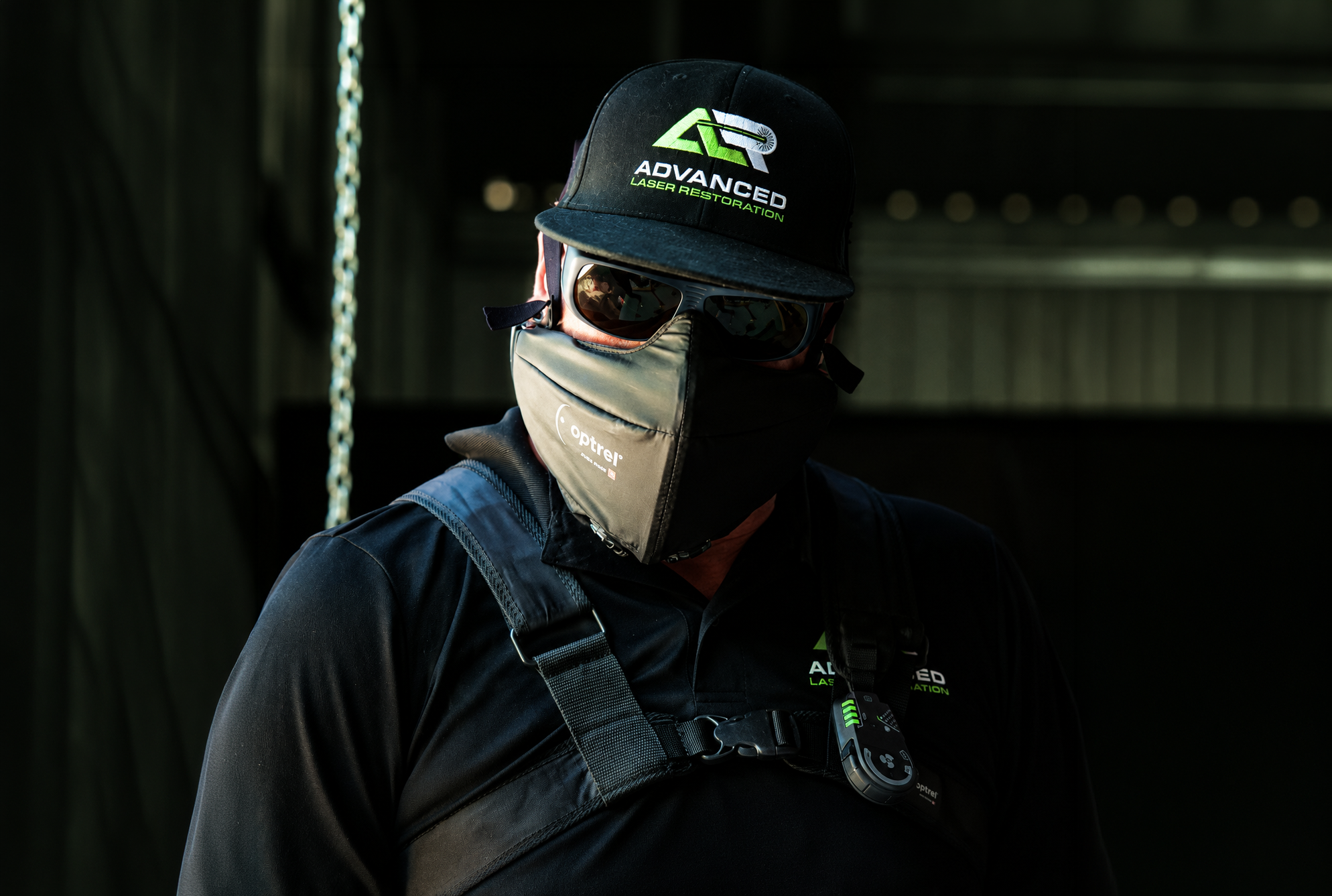 Laser cleaning operator wearing protective equipment