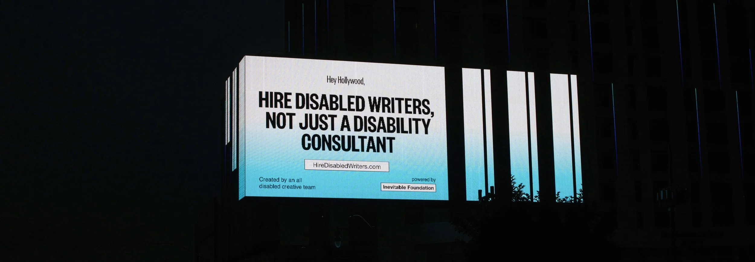A photograph of a billboard that reads,