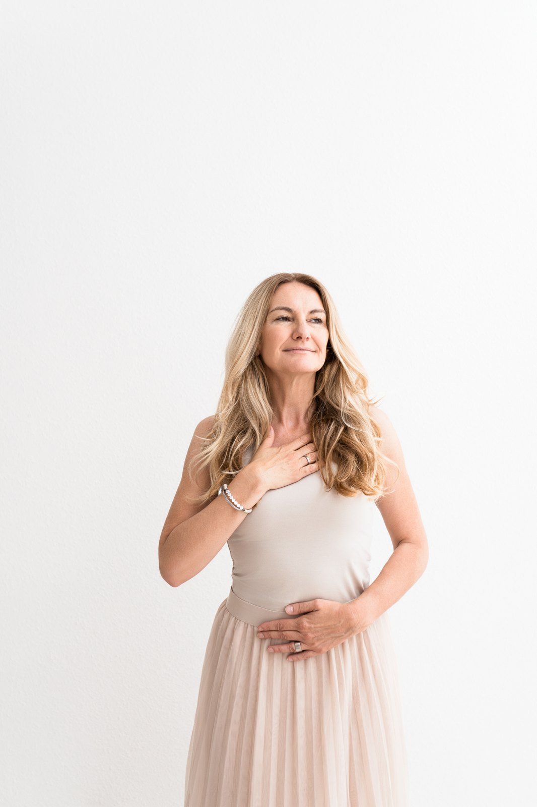Woman with her hand on her heart during a guided visualization