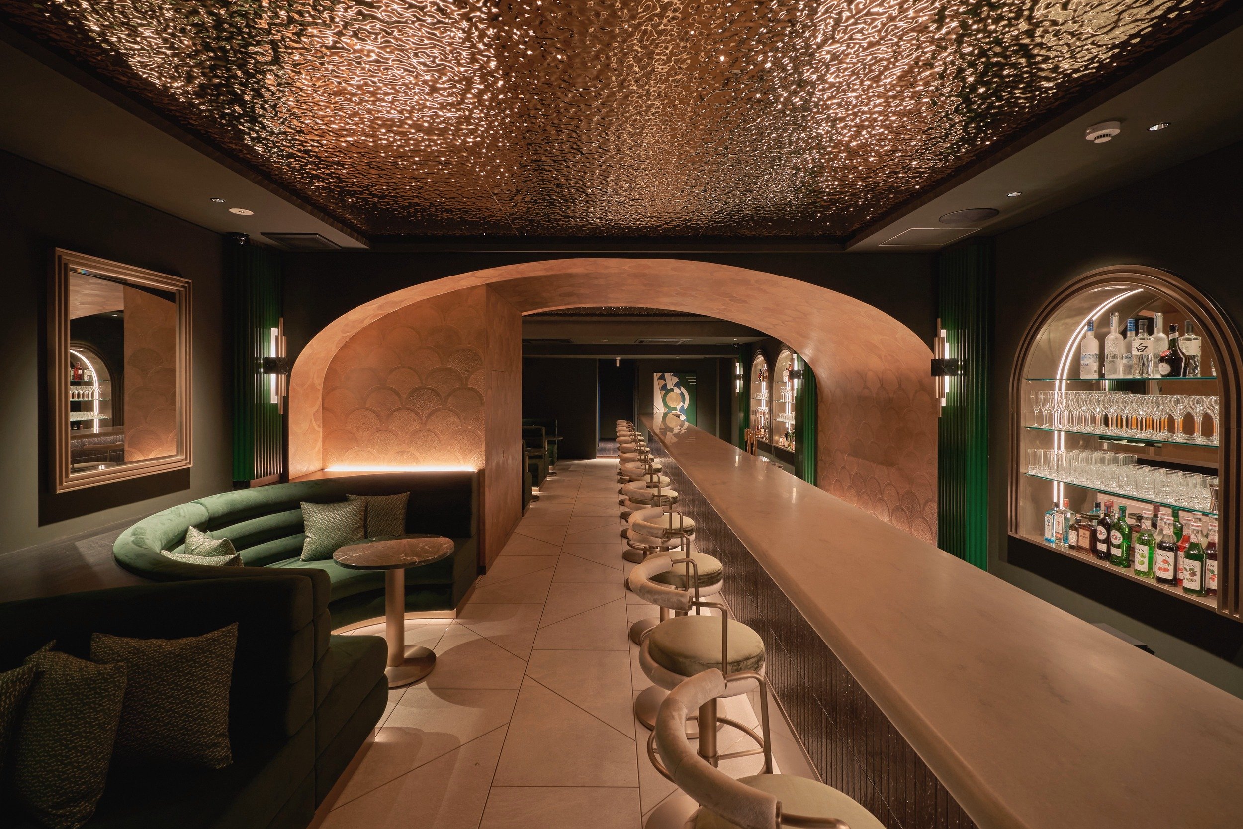 Satin — golden arch and bar interior