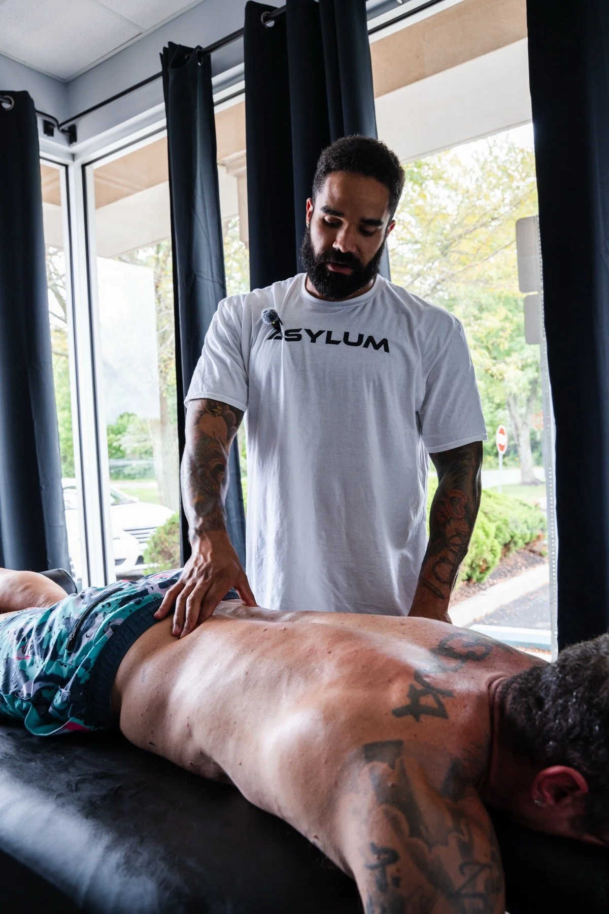 Asa Buchanon providing sports massage at Asylum