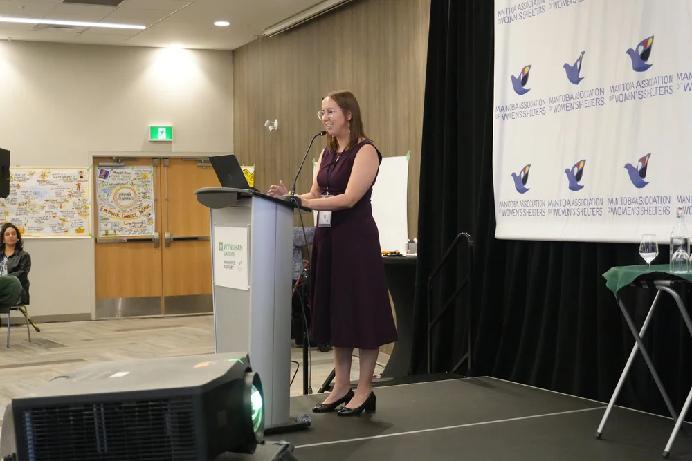 Monica on stage at the Gender-Based Violence Symposium