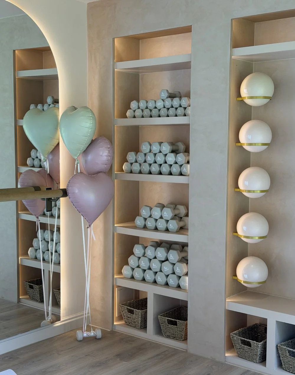 The Cobham studio with heart balloons by the weights shelves