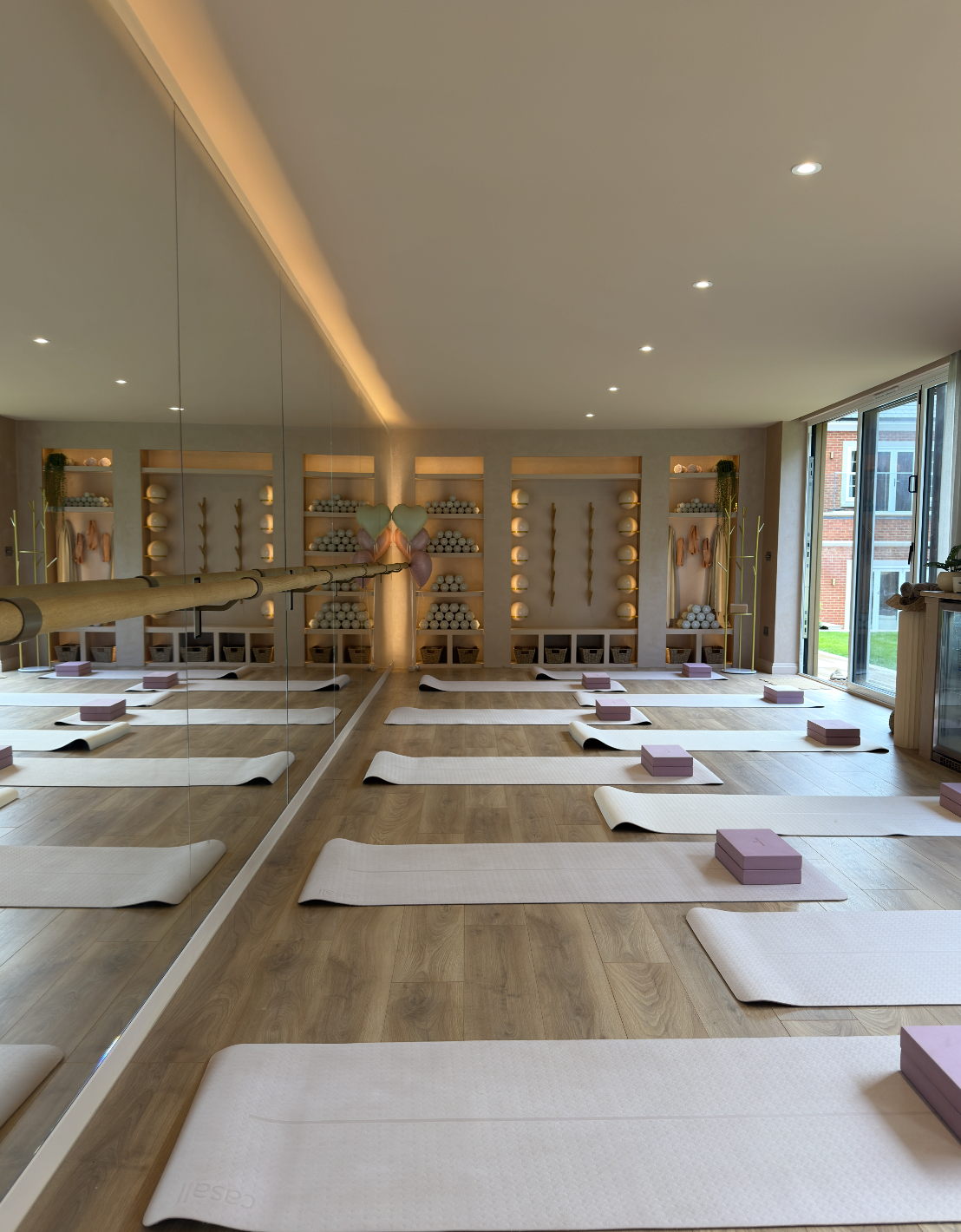 The Barre Coach studio in Cobham, set up with mats and blocks