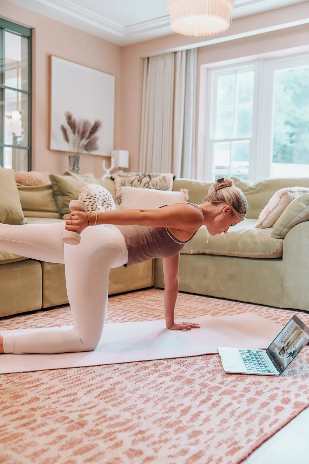 A live barre class at home on the laptop