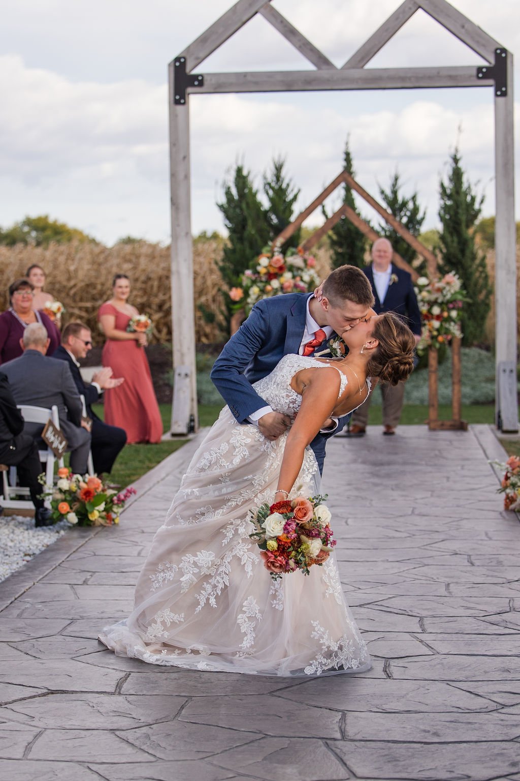 Wedding ceremony with guests gathered along the outdoor 75-foot aisle