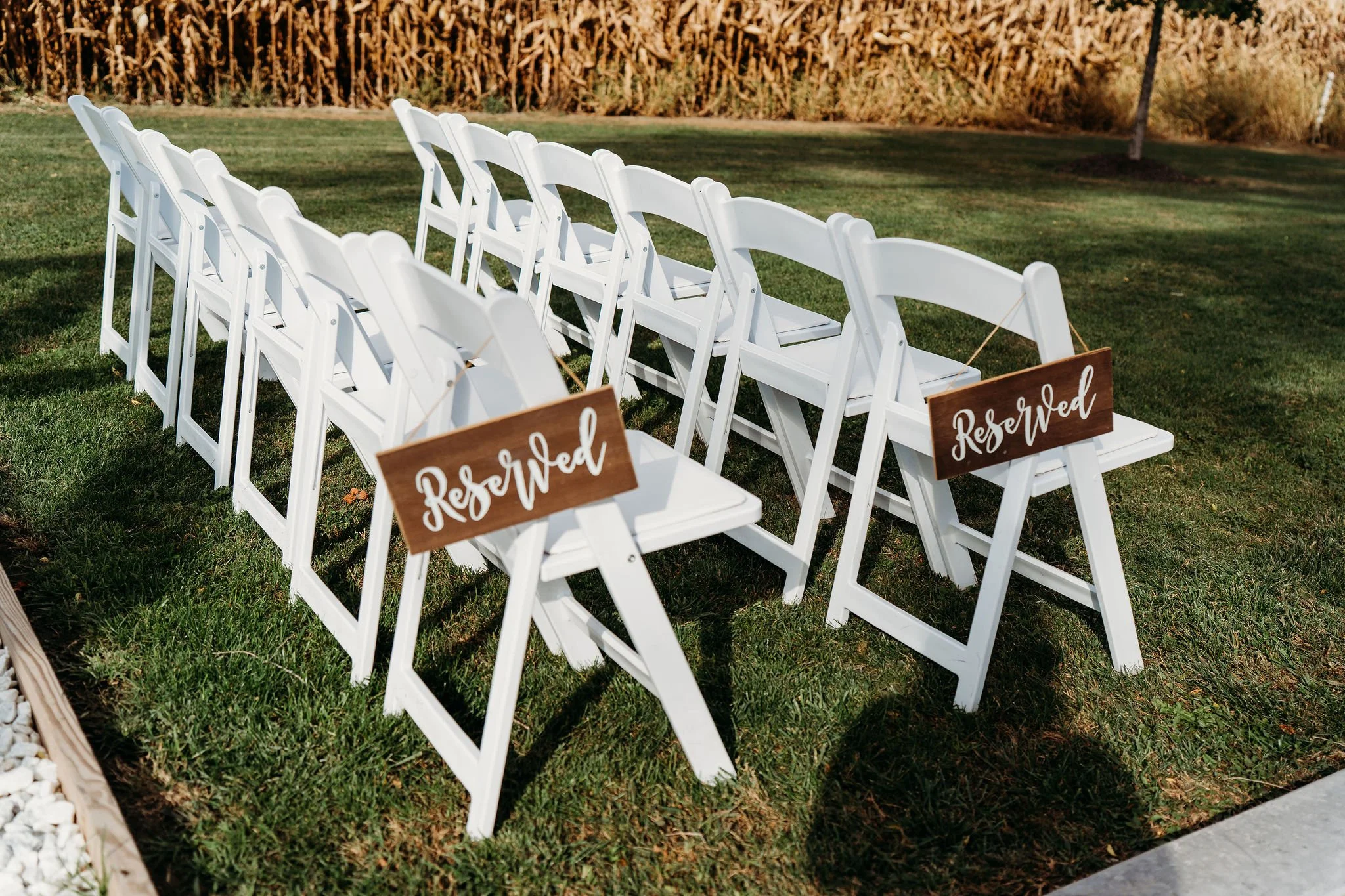 Wedding ceremony with guests gathered along the outdoor 75-foot aisle