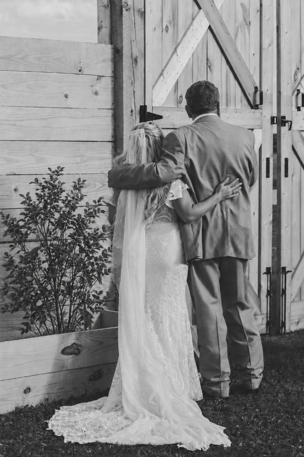 Wedding ceremony with guests gathered along the outdoor 75-foot aisle