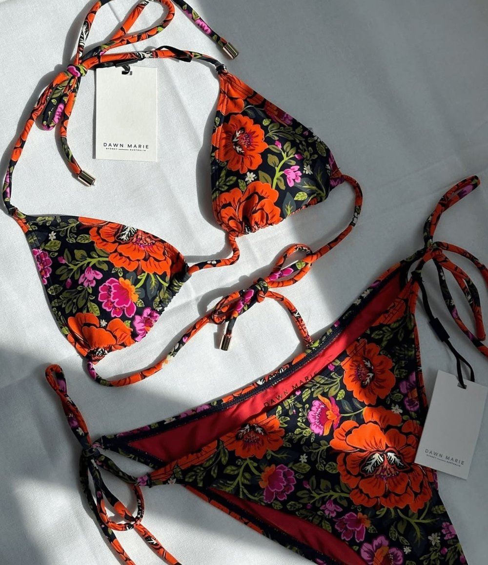 Logo design on swimsuit by Brisbane graphic designer
