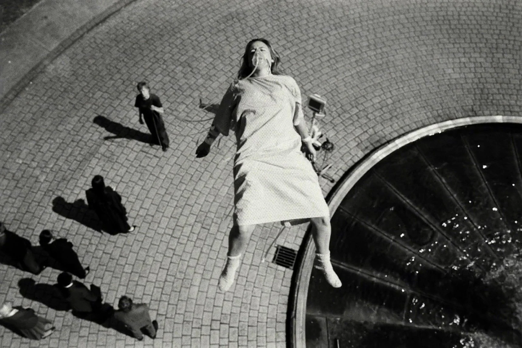 A surreal black-and-white Bugonia scene showing Teddy's mother suspended above the ground