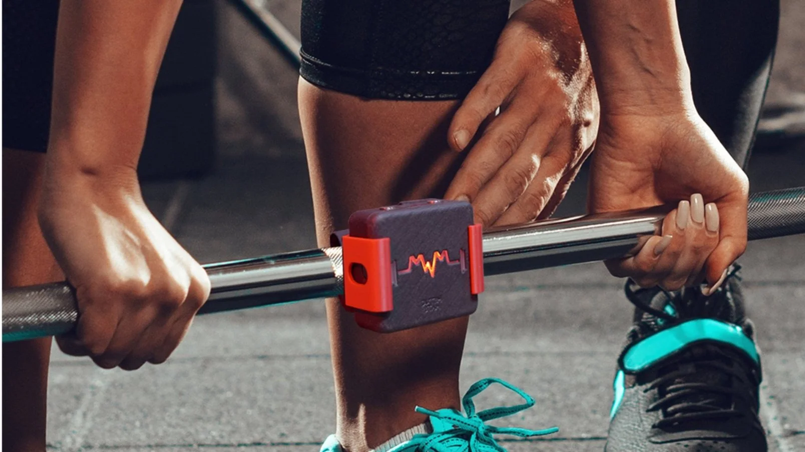 Metric Mate T.A.P. Sensor attached to a barbell