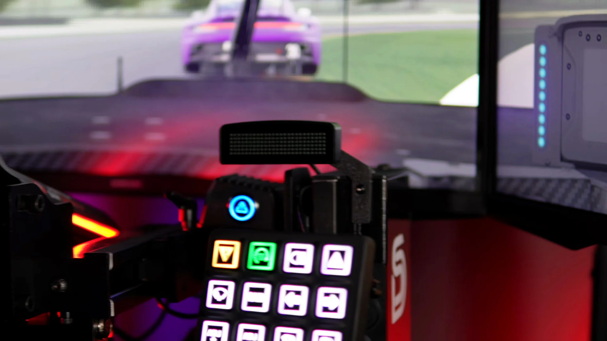 The compact display positioned beside the wheel.