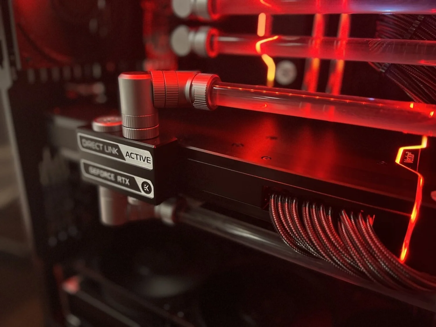 An EK water block and fitting on the graphics card