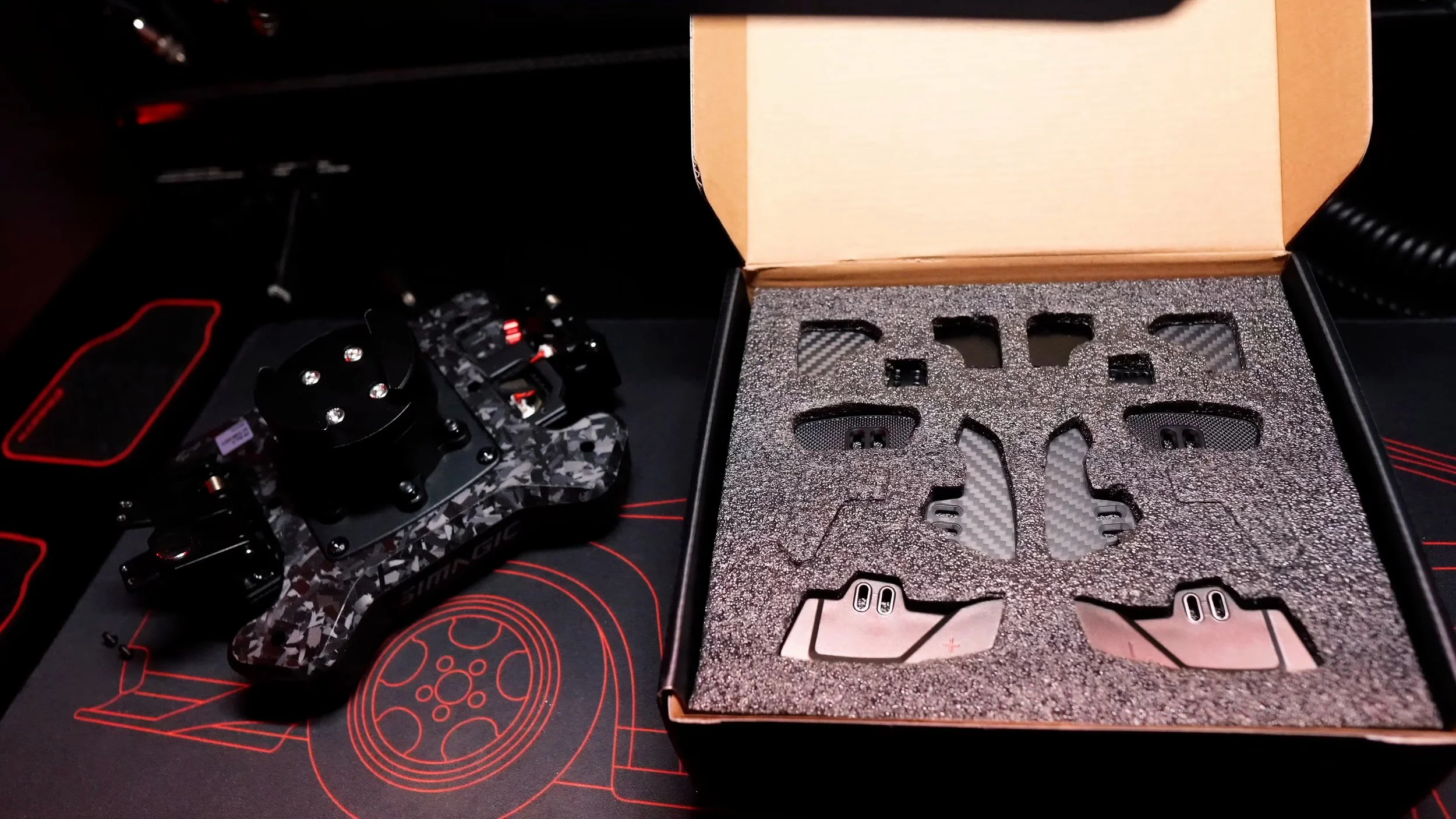 The module and supplied hardware in the packaging.