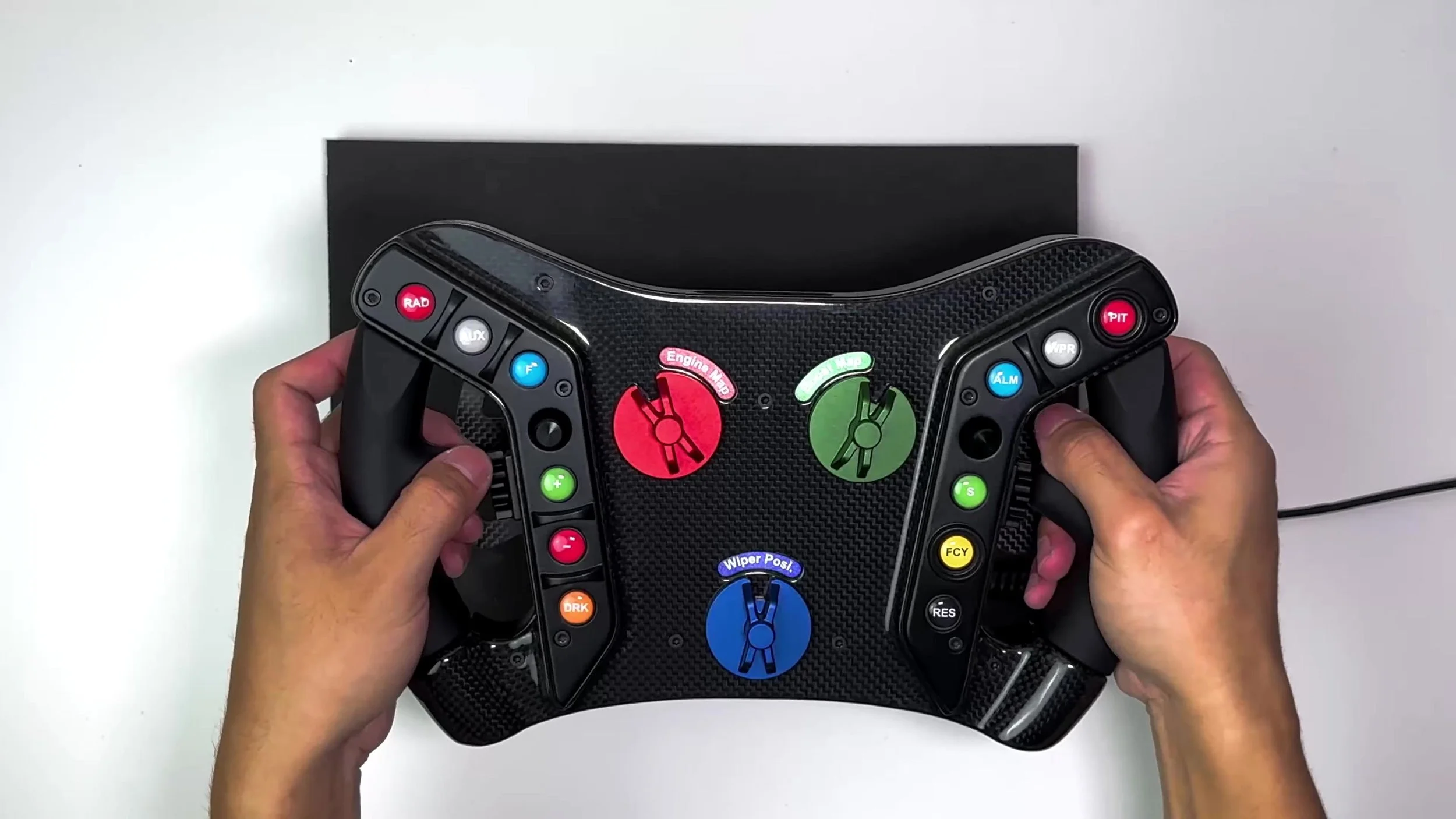 The grips and front button layout in hand.