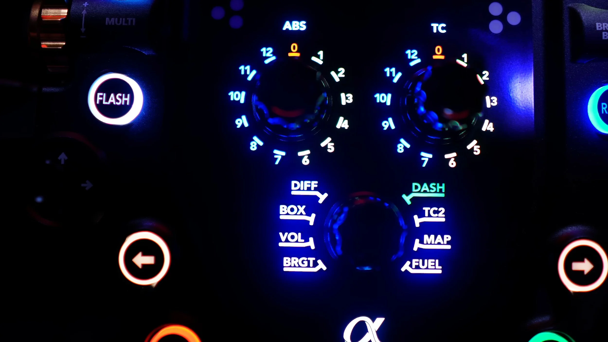 The rotary selectors and button labels lit up.