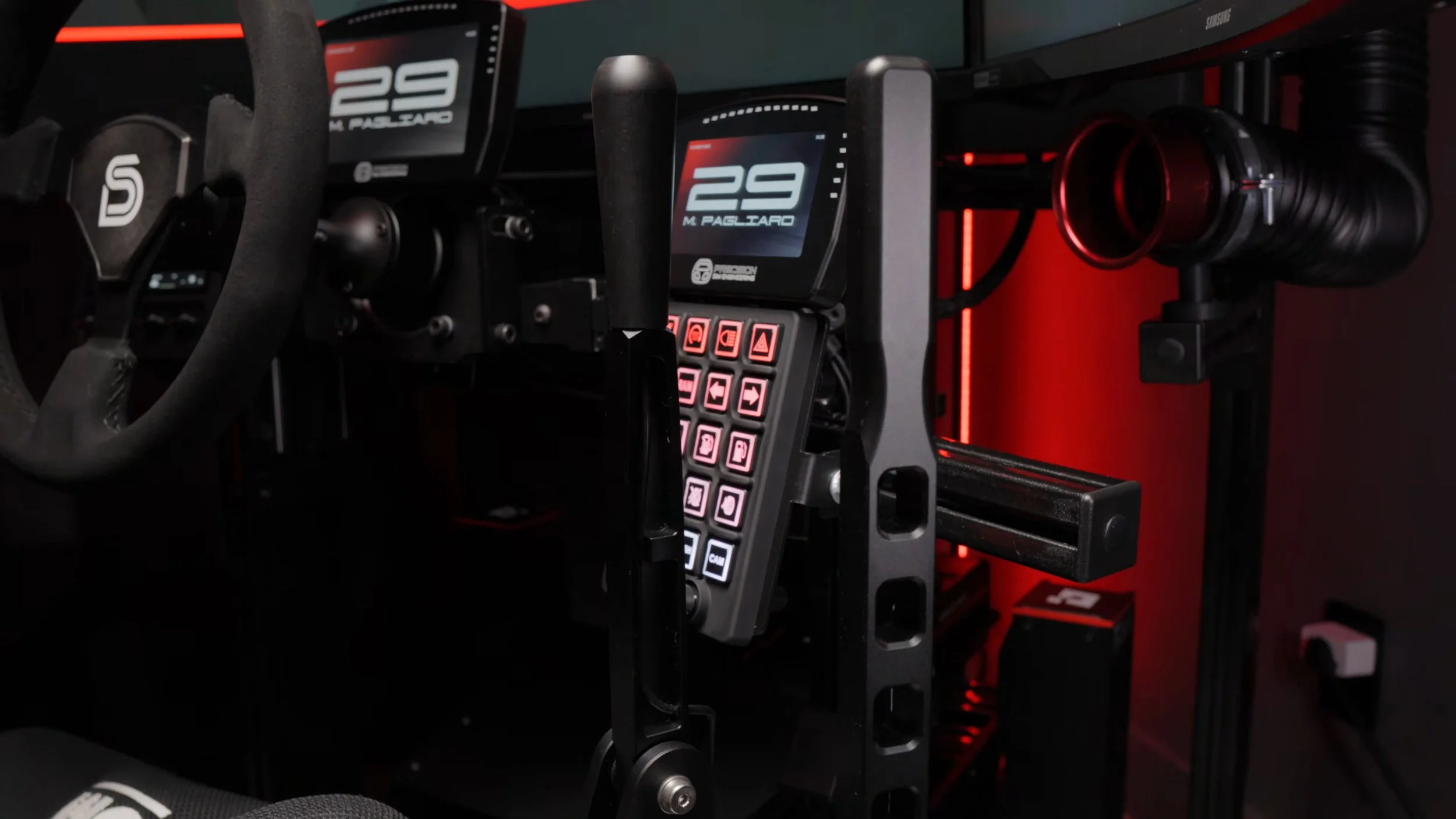 The SG Racing controls installed beside the steering wheel.