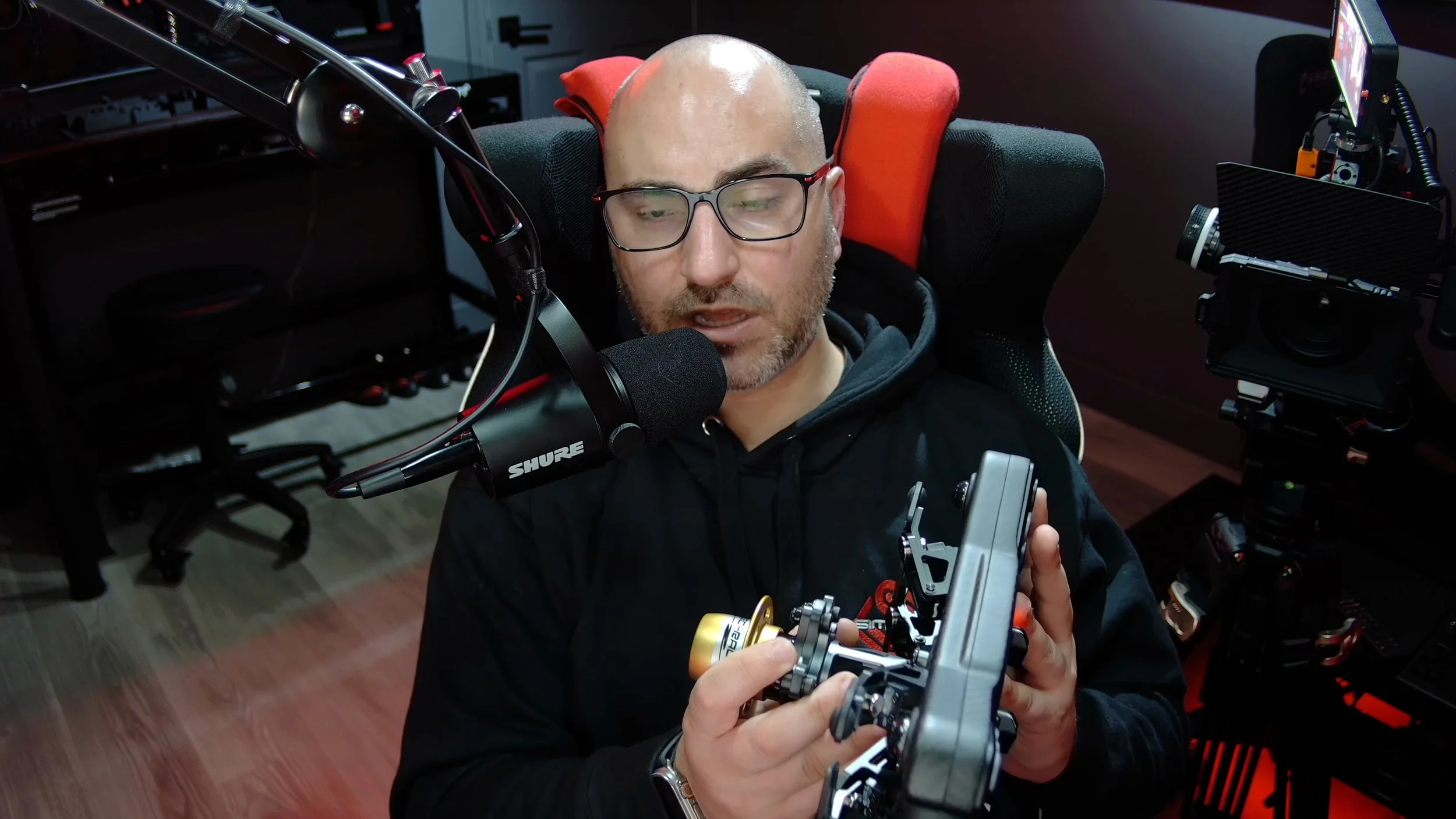 Demonstrating the quick release on the back of a wheel.