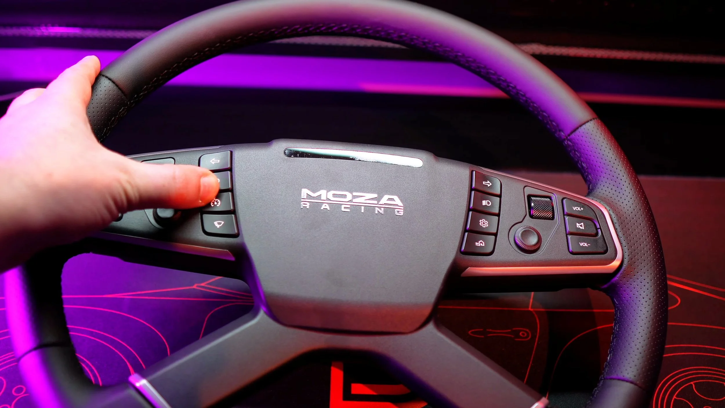 Operating the buttons on the wheel.