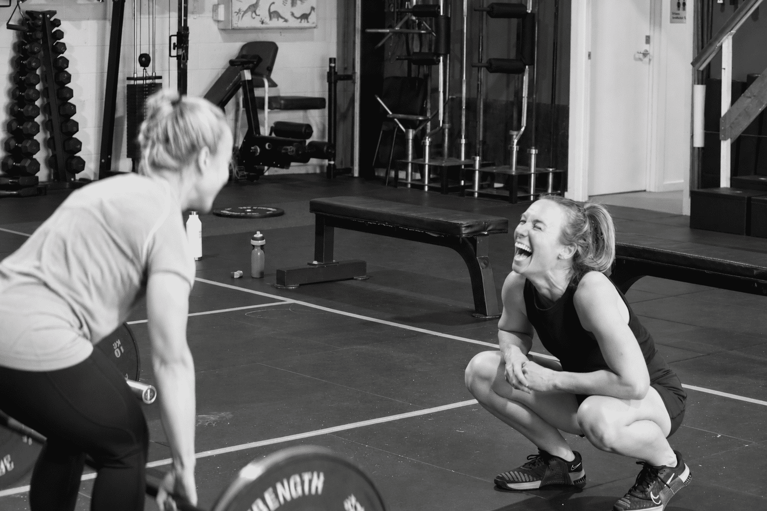 Two Solace members sharing a laugh at the gym.