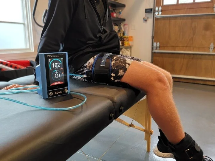 Blood flow restriction therapy cuff used during physical therapy exercise