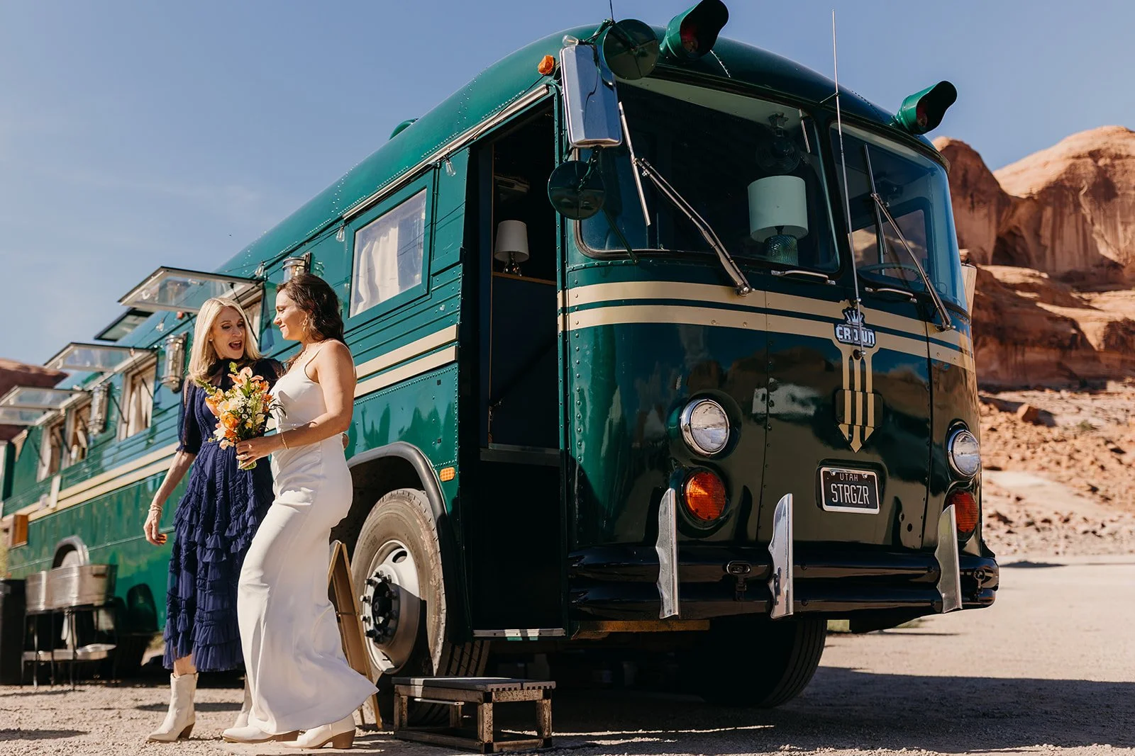 Couple celebrating with champagne beside the Stargazer mobile bar