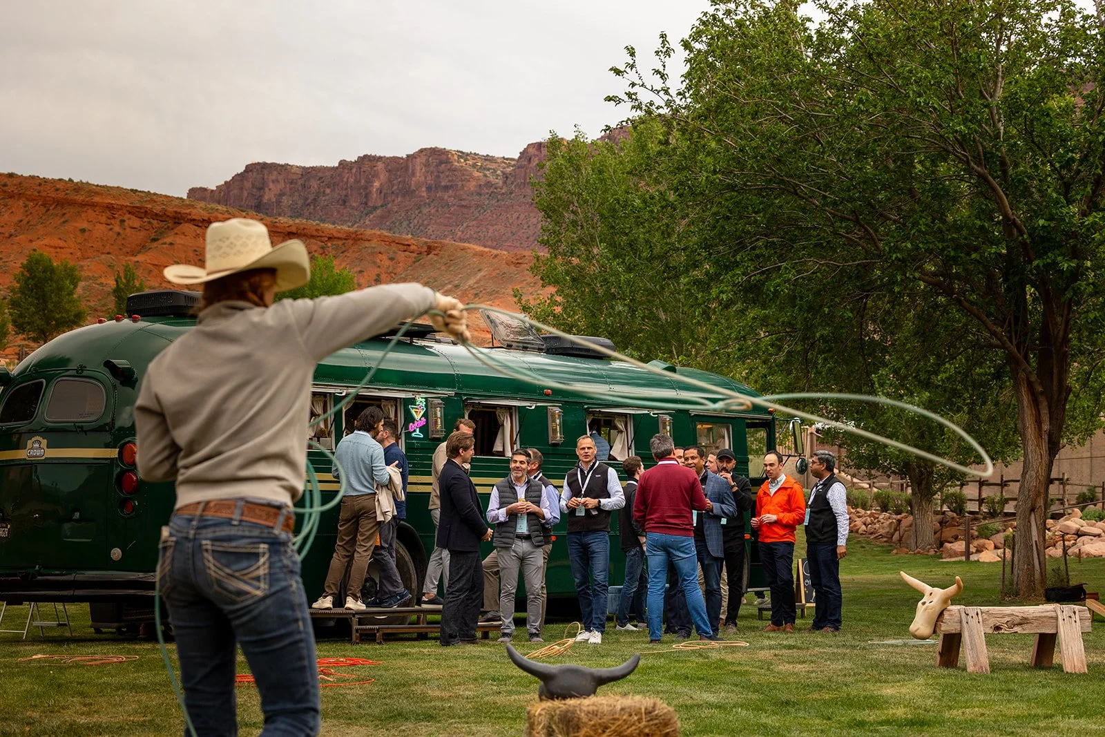 Regina parked at Red Cliffs Lodge with guests lassoing outside