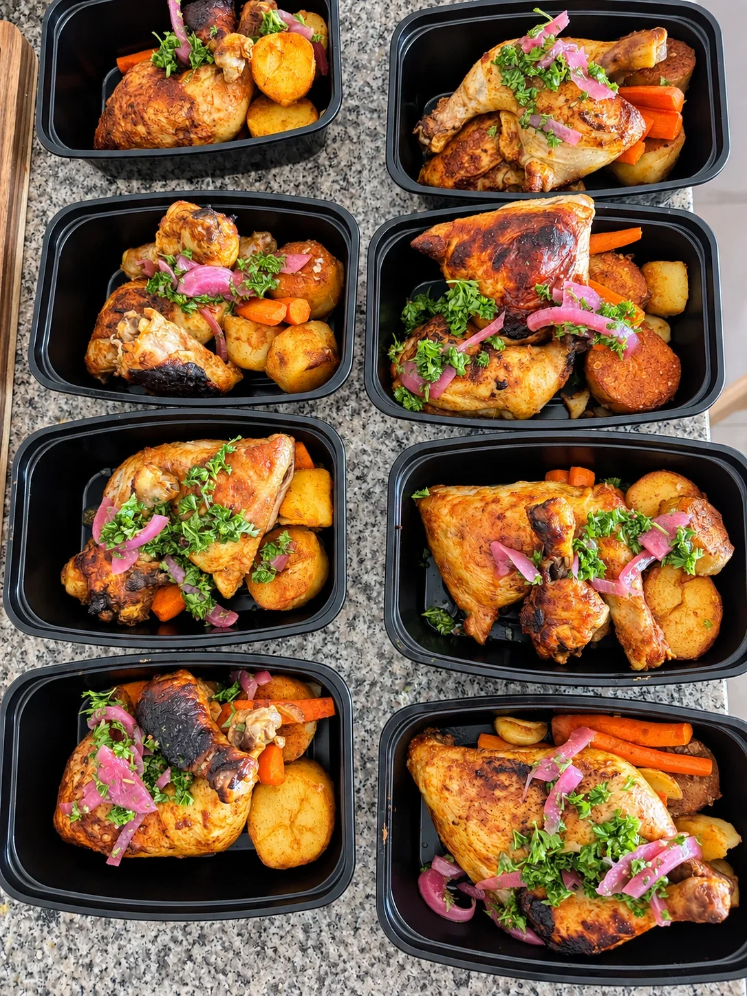 Roasted chicken, potatoes and vegetables individually portioned in meal containers by Chef Collin