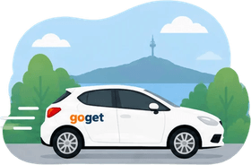 White GoGet car driving