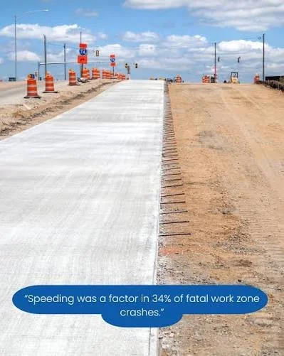 Representative highway construction zone with new concrete pavement and traffic barrels