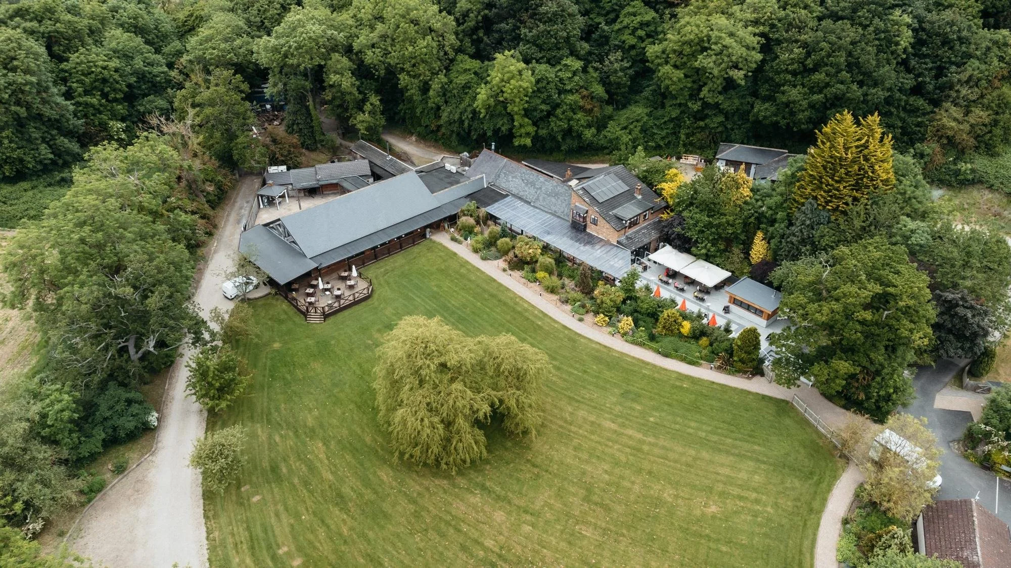Aerial view of Whinstone View in Great Ayton showing Wray’s Barn, the lawns and surrounding trees