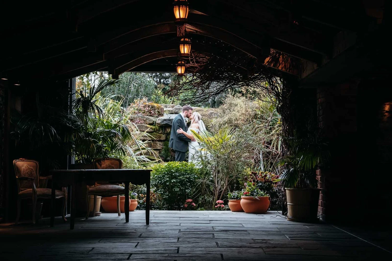 View through an archway into the gardens at Newton Hall in Newton-by-the-Sea