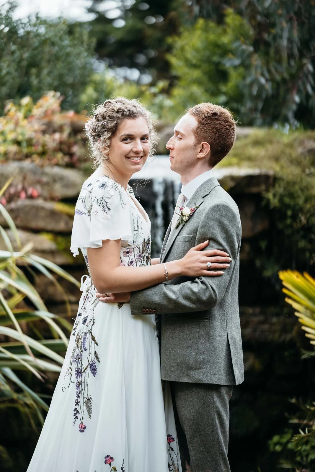 Couple laughing together in the planted garden at Newton Hall