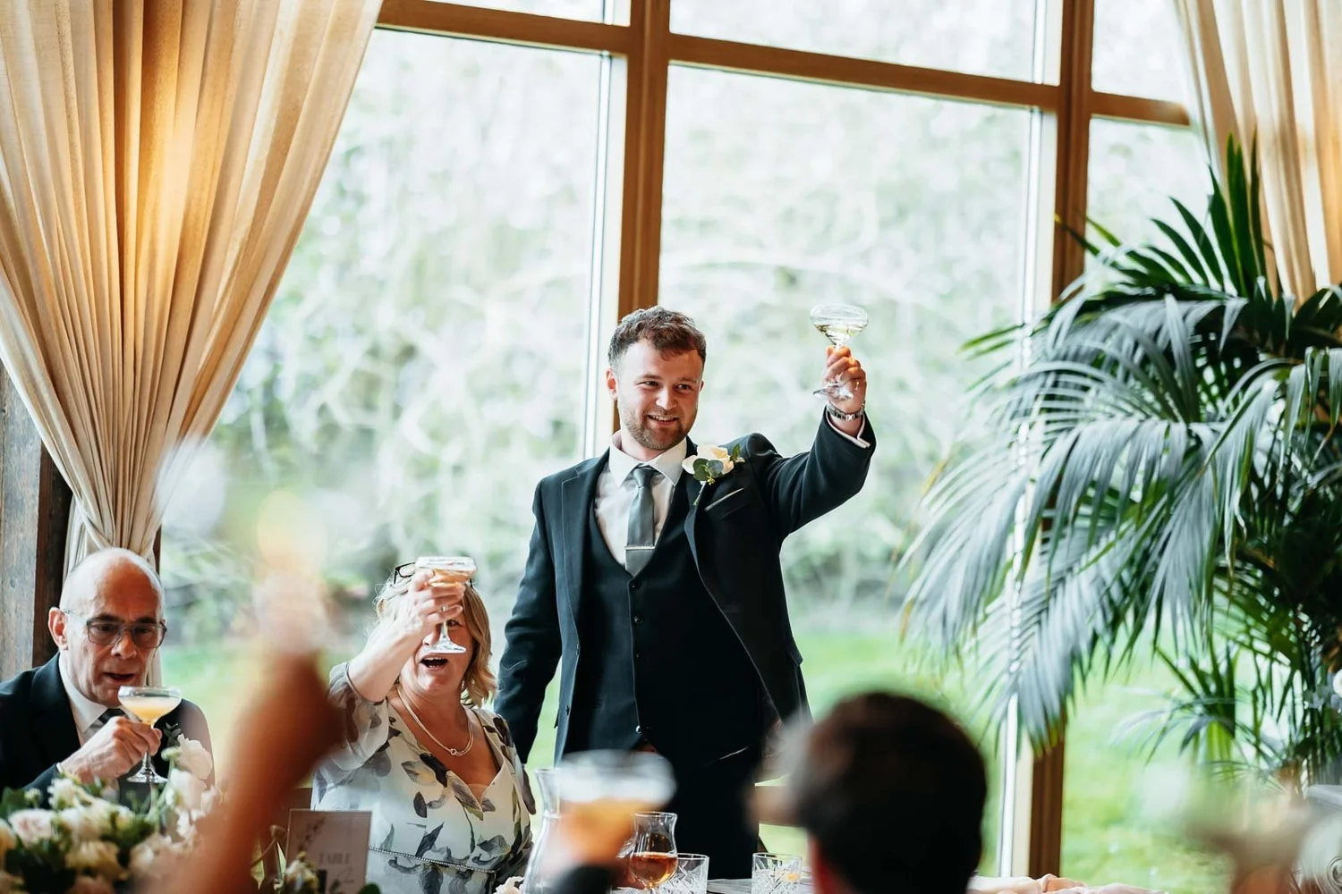 Speech in the Garden Suite at Newton Hall with daylight from the wall of glass