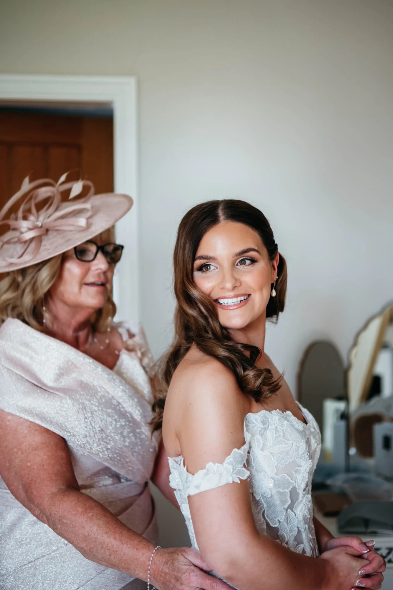 Bride and her mum sharing a moment in the bridal room on the morning of a Thirsk Lodge Barns wedding