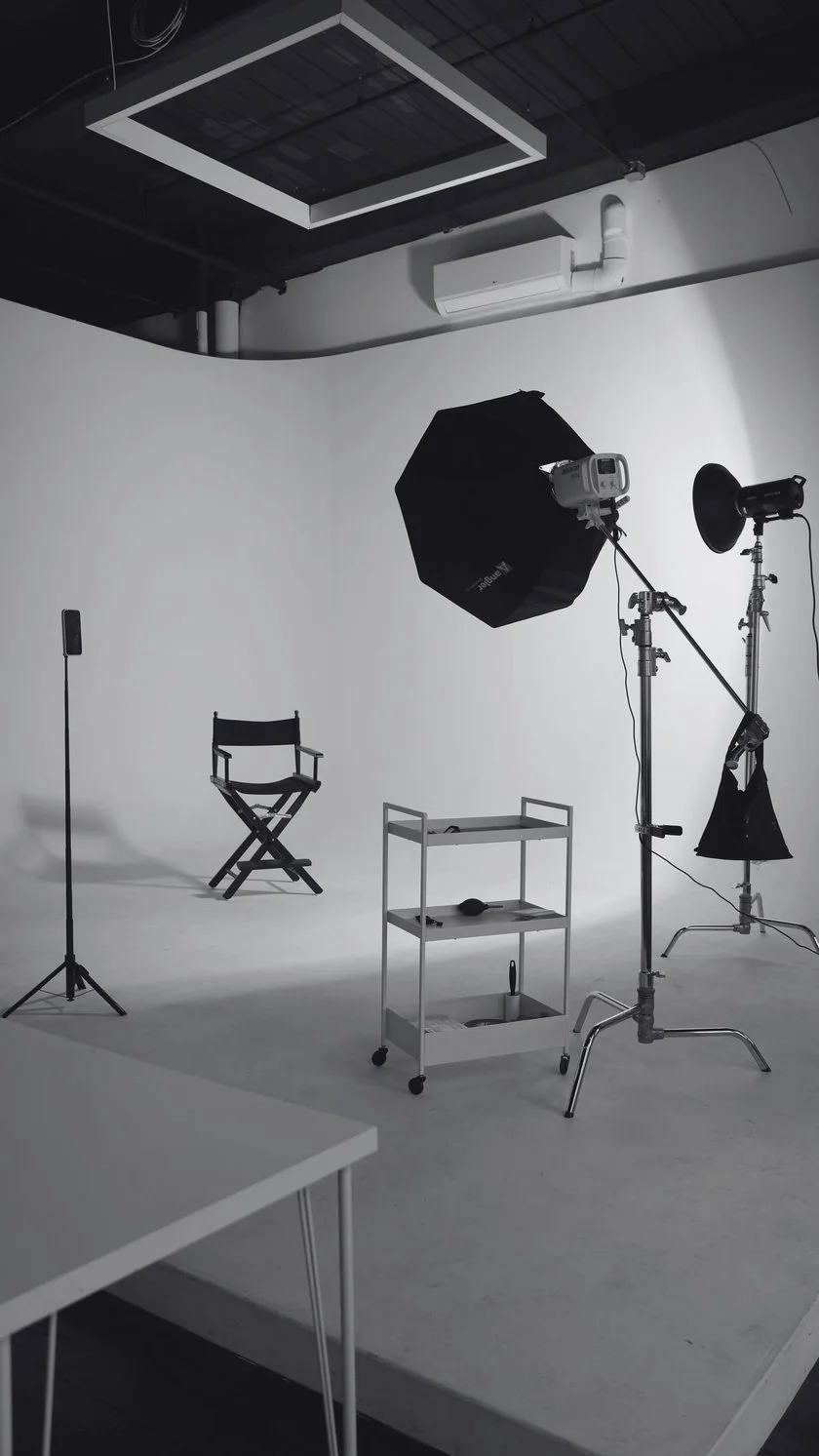 Illustrated photo studio with lights and a director's chair