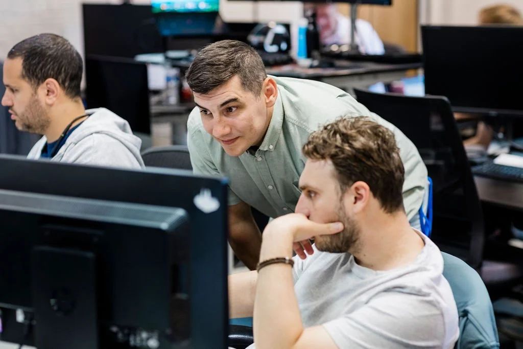 IT support team assisting a customer